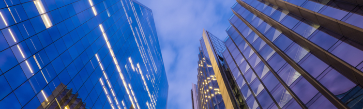 Looking up to the glass and steel skyscrapers in the heart of London’s Financial District.