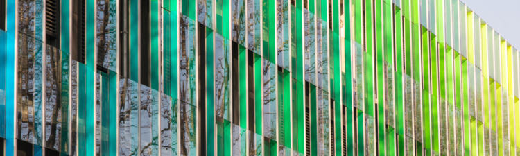 Public Office building with colorful graduated shading and reflexions in windows