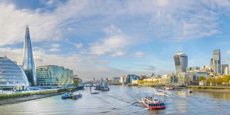 London skyline, United Kingdom - cityscape with modern buildings and Tower of London in autumn under blue bright sky