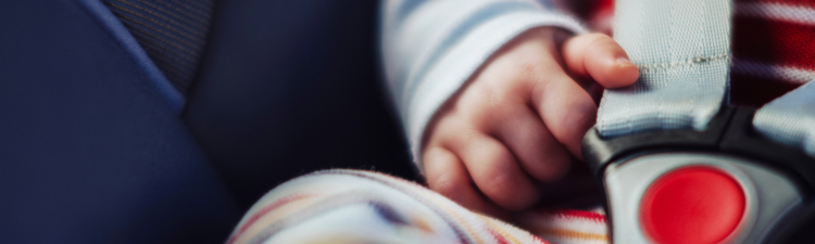 Baby in car seat, close up.