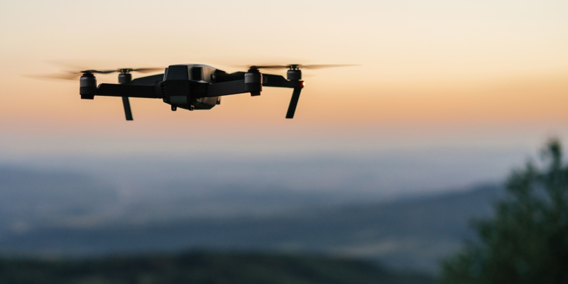 Flying drone at dusk