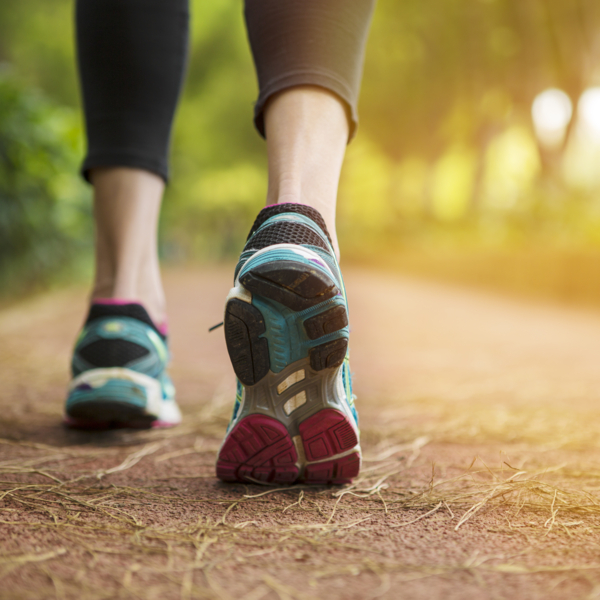 Woman running on a path.close up.