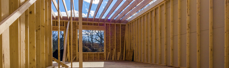 New framing house construction with no roof and two by fours exposed